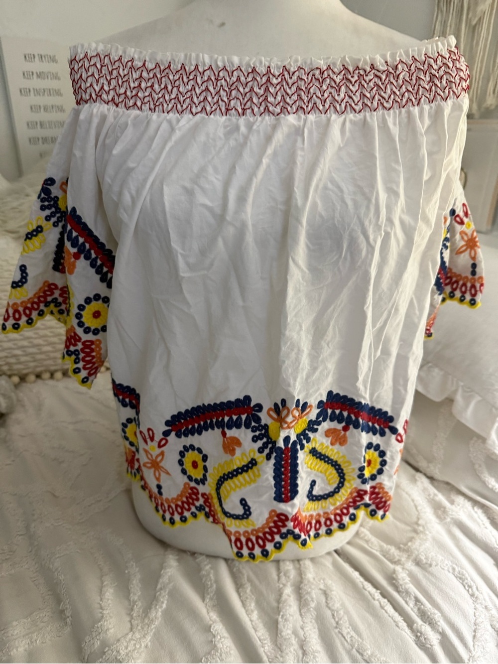 Romeo & Juliet Couture White Off-Shoulder Top with Red and Navy Embroidery